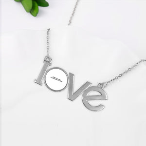 Couple pendant necklace with the letters LOVE